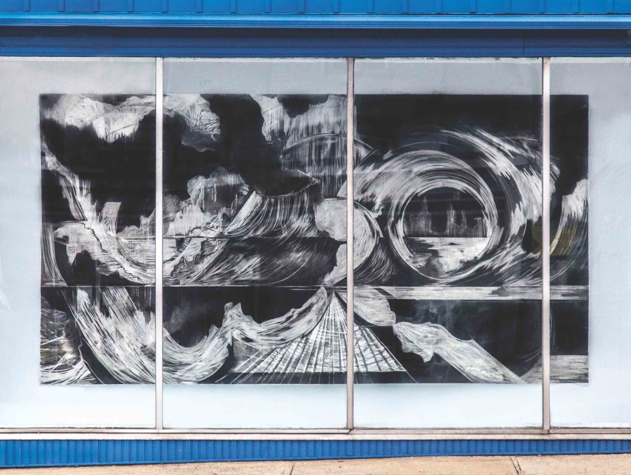 Swirling black and white images emerge in an artwork by Beatrice Modisett.